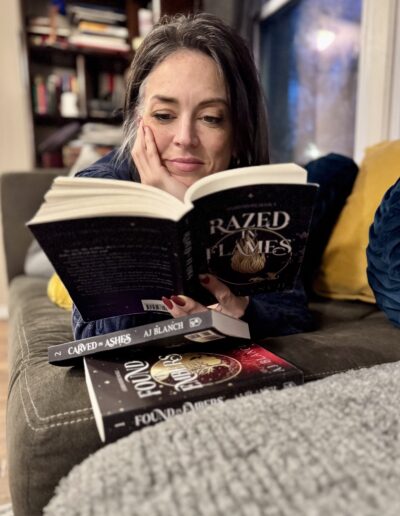 happy woman reading razed in flames